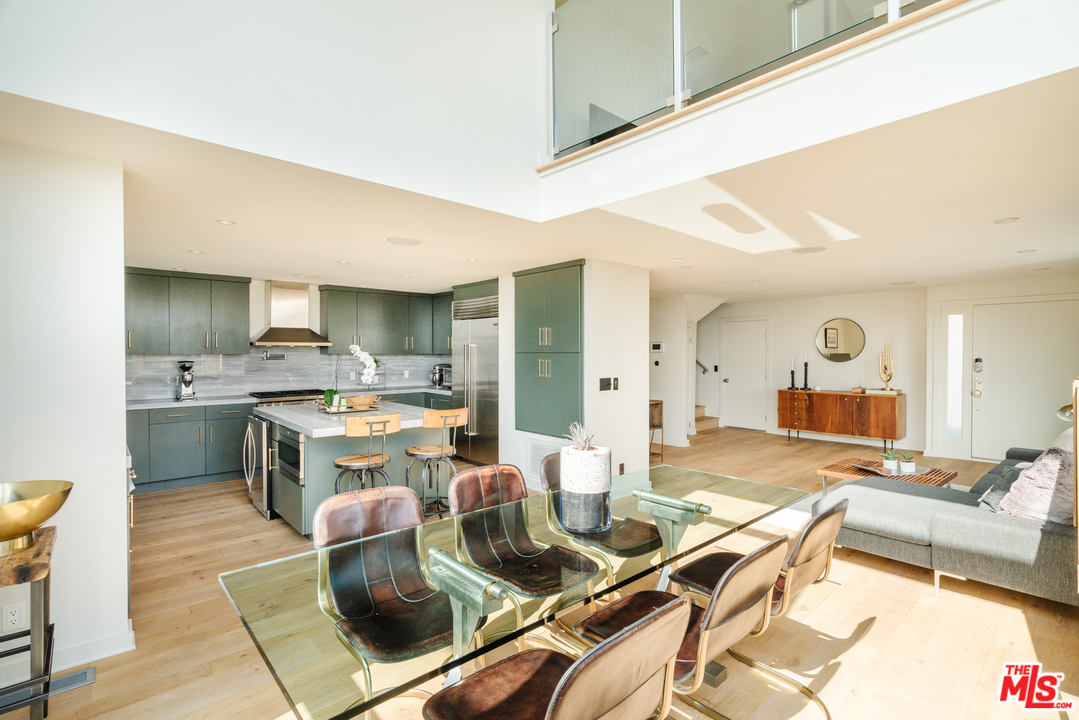 9318 Warbler Way Los Angeles, CA 90069 - Photo 10 of 46 a living room with stainless steel appliances kitchen island granite countertop furniture and a kitchen view