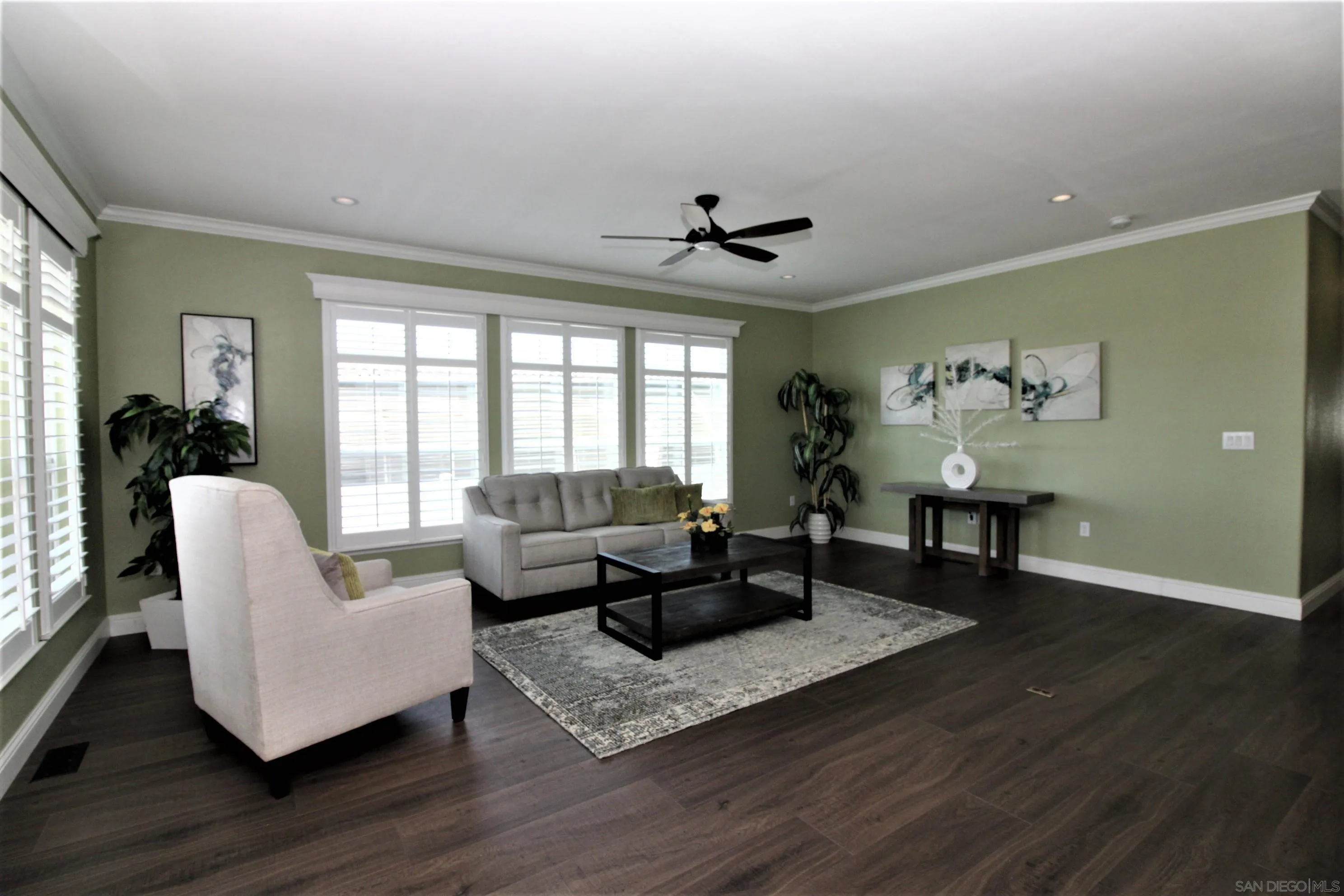 7132 Santa Rosa Carlsbad, CA 92011 - Photo 8 of 54 a living room with furniture and a wooden floor