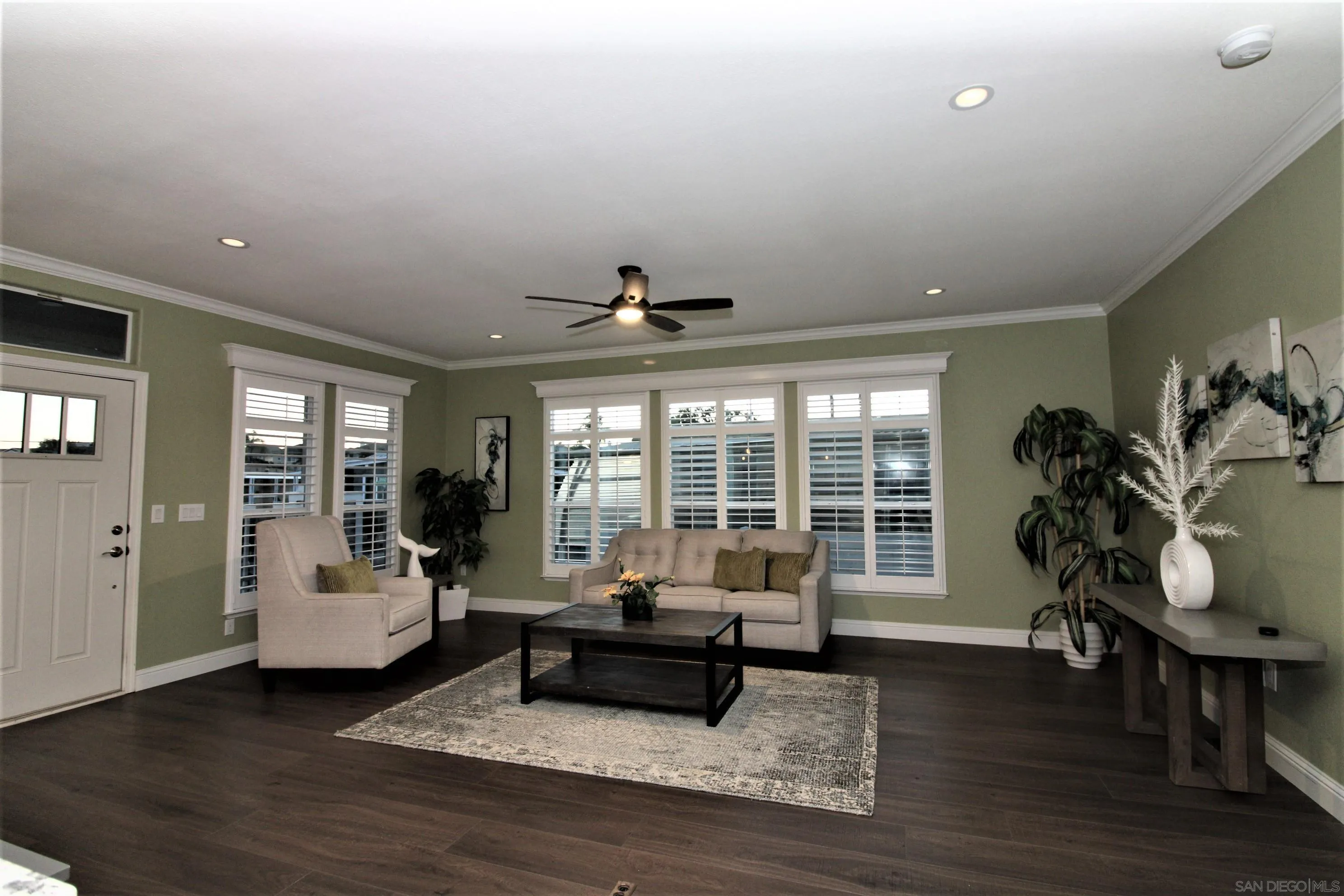 7132 Santa Rosa Carlsbad, CA 92011 - Photo 9 of 54 a living room with furniture and wooden floor