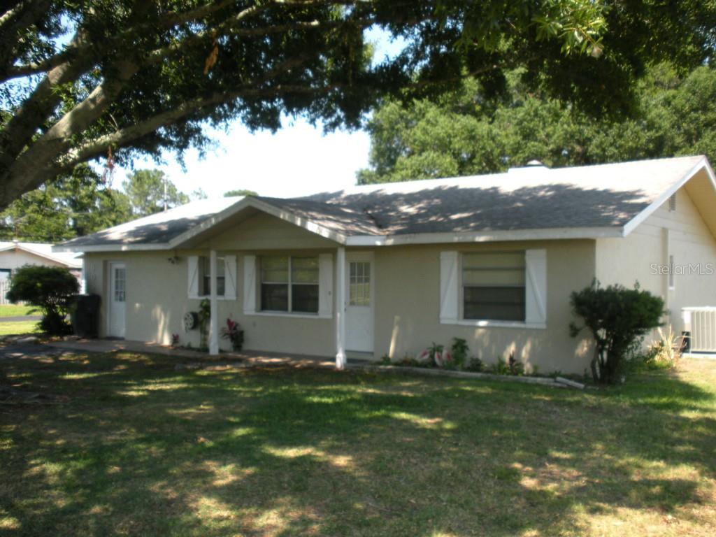 905 Mosley Road Lake Alfred, FL 33850 - Photo 1 of 1 a front view of house with yard and outdoor seating