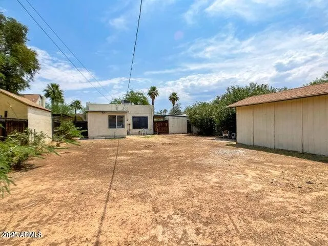 a view of a backyard of the house