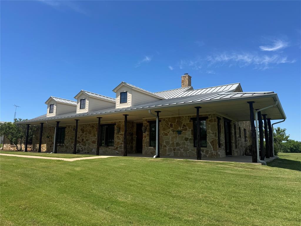11918 Riek Road Krum, TX 76249 - Photo 1 of 40 a view of a white house with a large tree