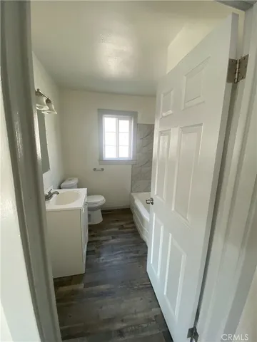 a bathroom with sink a toilet and a shower