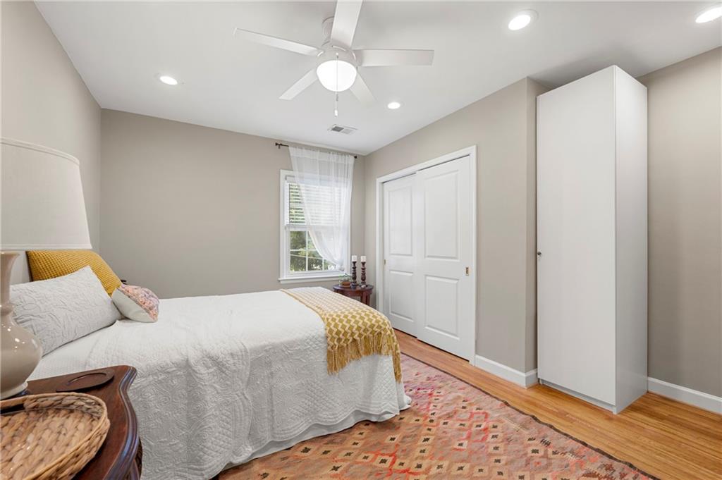 542 Goldsboro Road Northeast, Unit D Atlanta, GA 30307 - Photo 13 of 26 a bedroom with a bed and a window