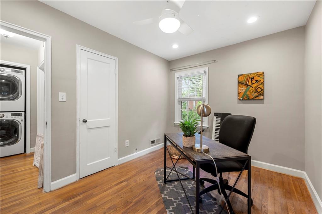 542 Goldsboro Road Northeast, Unit D Atlanta, GA 30307 - Photo 17 of 26 a dining room with furniture and wooden floor