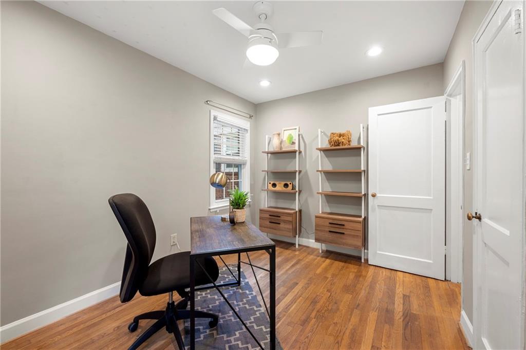 542 Goldsboro Road Northeast, Unit D Atlanta, GA 30307 - Photo 18 of 26 a view of a workspace with furniture and wooden floor