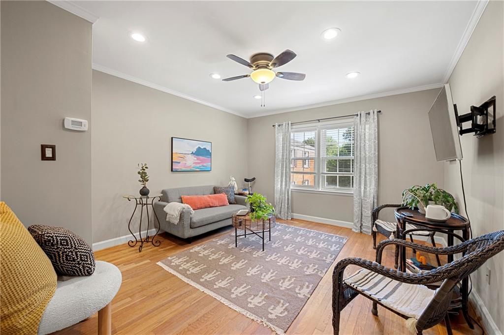 542 Goldsboro Road Northeast, Unit D Atlanta, GA 30307 - Photo 2 of 26 a living room with furniture and windows