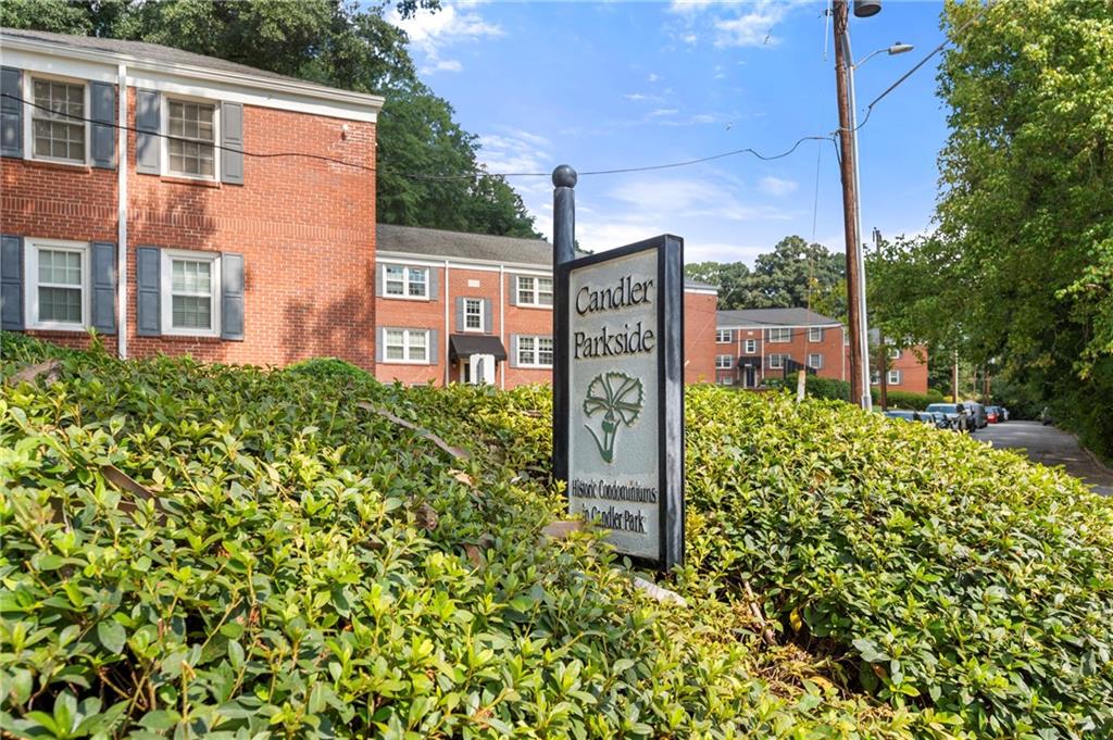 542 Goldsboro Road Northeast, Unit D Atlanta, GA 30307 - Photo 23 of 26 a sign board with a yard and plants
