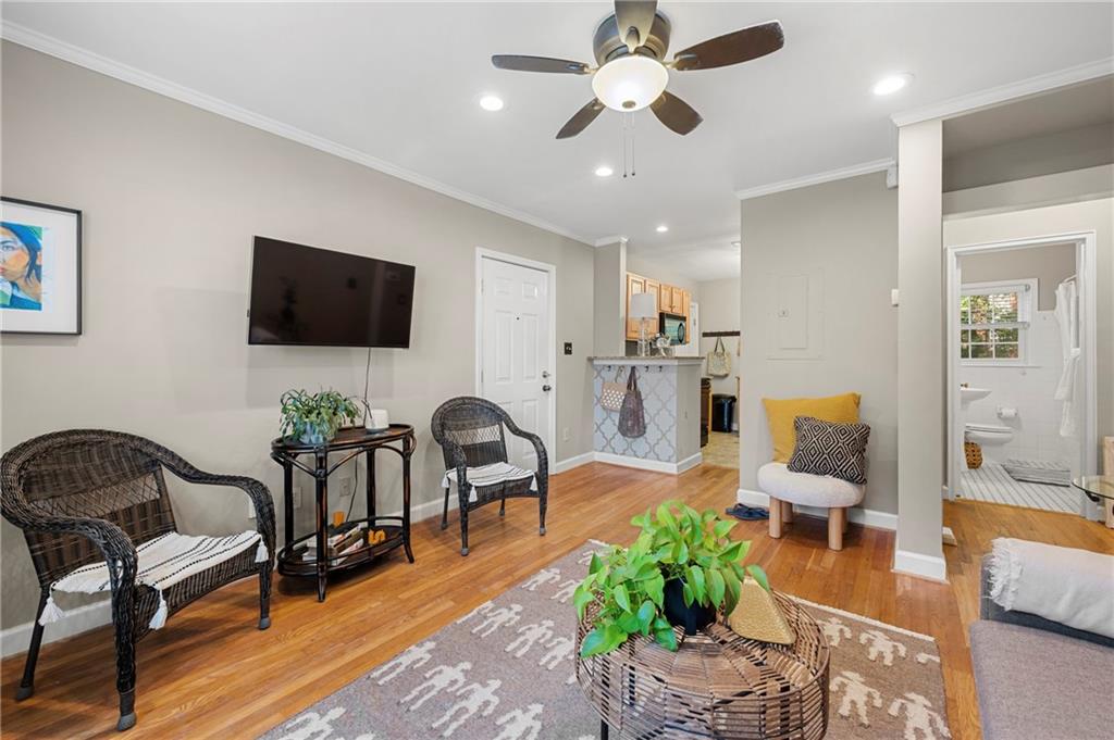 542 Goldsboro Road Northeast, Unit D Atlanta, GA 30307 - Photo 4 of 26 a living room with furniture and a flat screen tv