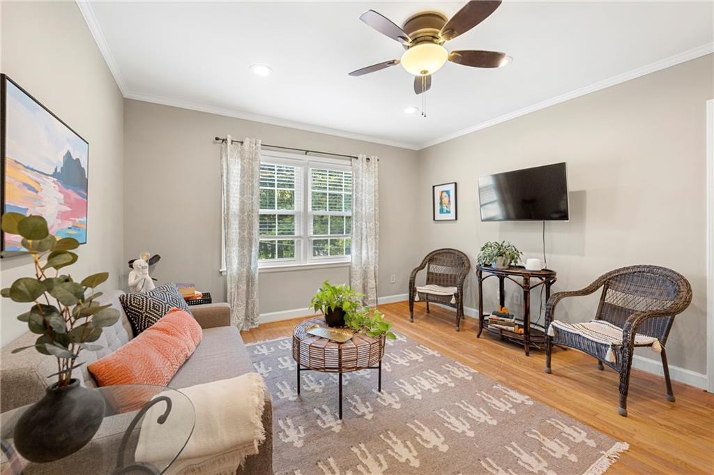 542 Goldsboro Road Northeast, Unit D Atlanta, GA 30307 - Photo 5 of 26 a living room with furniture and a flat screen tv