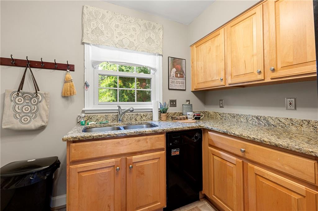 542 Goldsboro Road Northeast, Unit D Atlanta, GA 30307 - Photo 8 of 26 a kitchen with stainless steel appliances granite countertop a sink a stove and a microwave