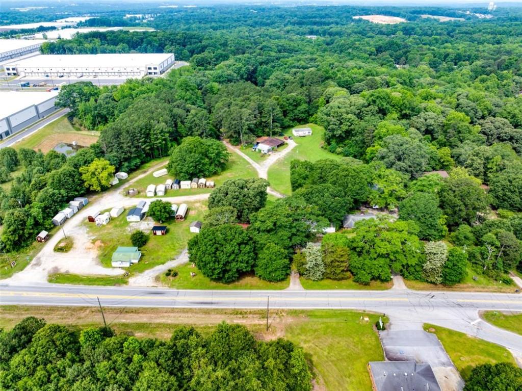 17 Lk Pk Drive Braselton, GA 30517 - Photo 3 of 6 an aerial view of a house with a yard and lake view