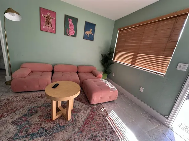 a bathroom with a sink mirror and toilet