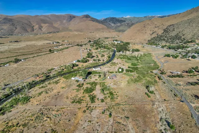 a view of a town with mountains in the background