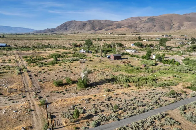 a view of mountain view with mountain and trees in the background