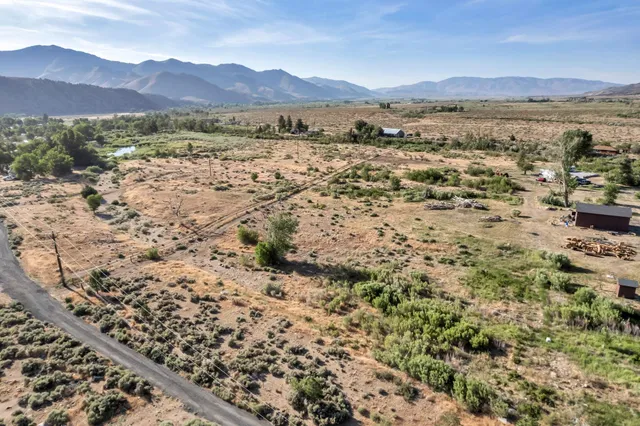 a view of city and mountain with lake view