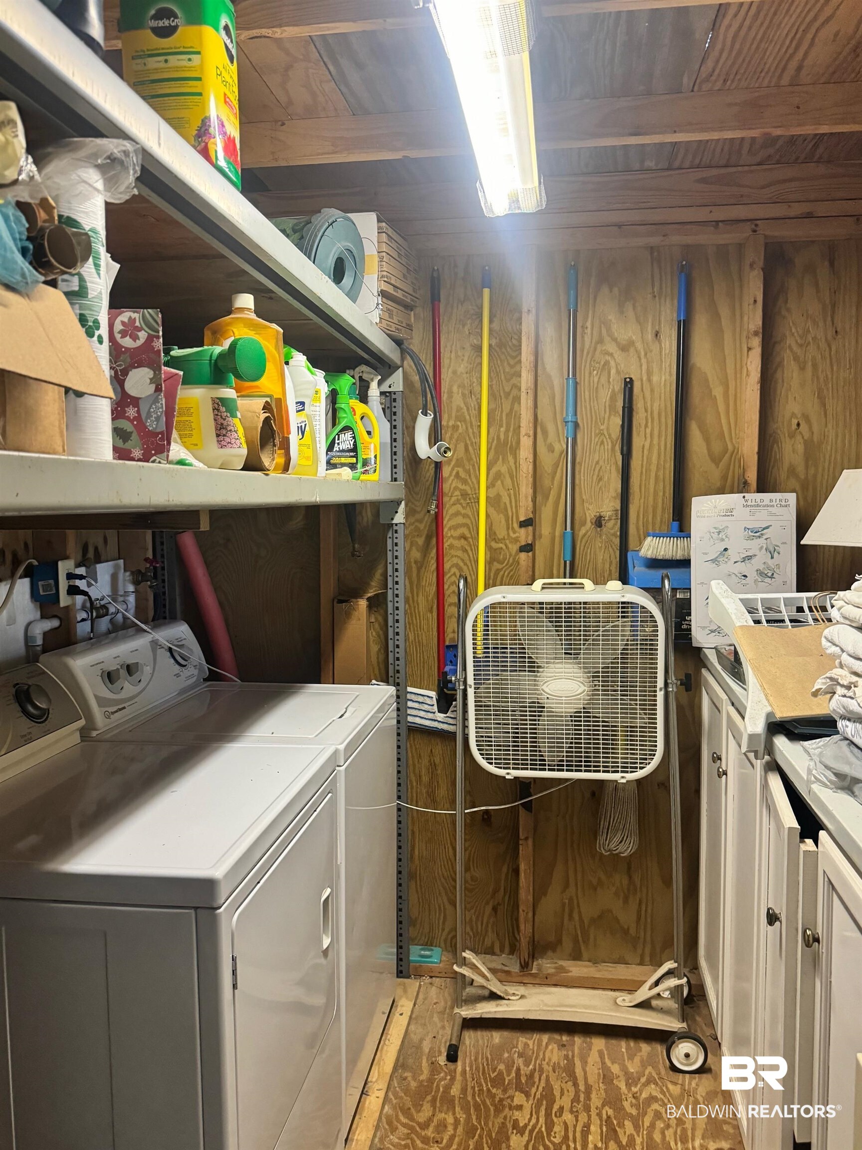 112 Horn Drive Lillian, AL 36549 - Photo 10 of 30 Clothes washing area with cabinets, independent washer and dryer, and wooden walls
