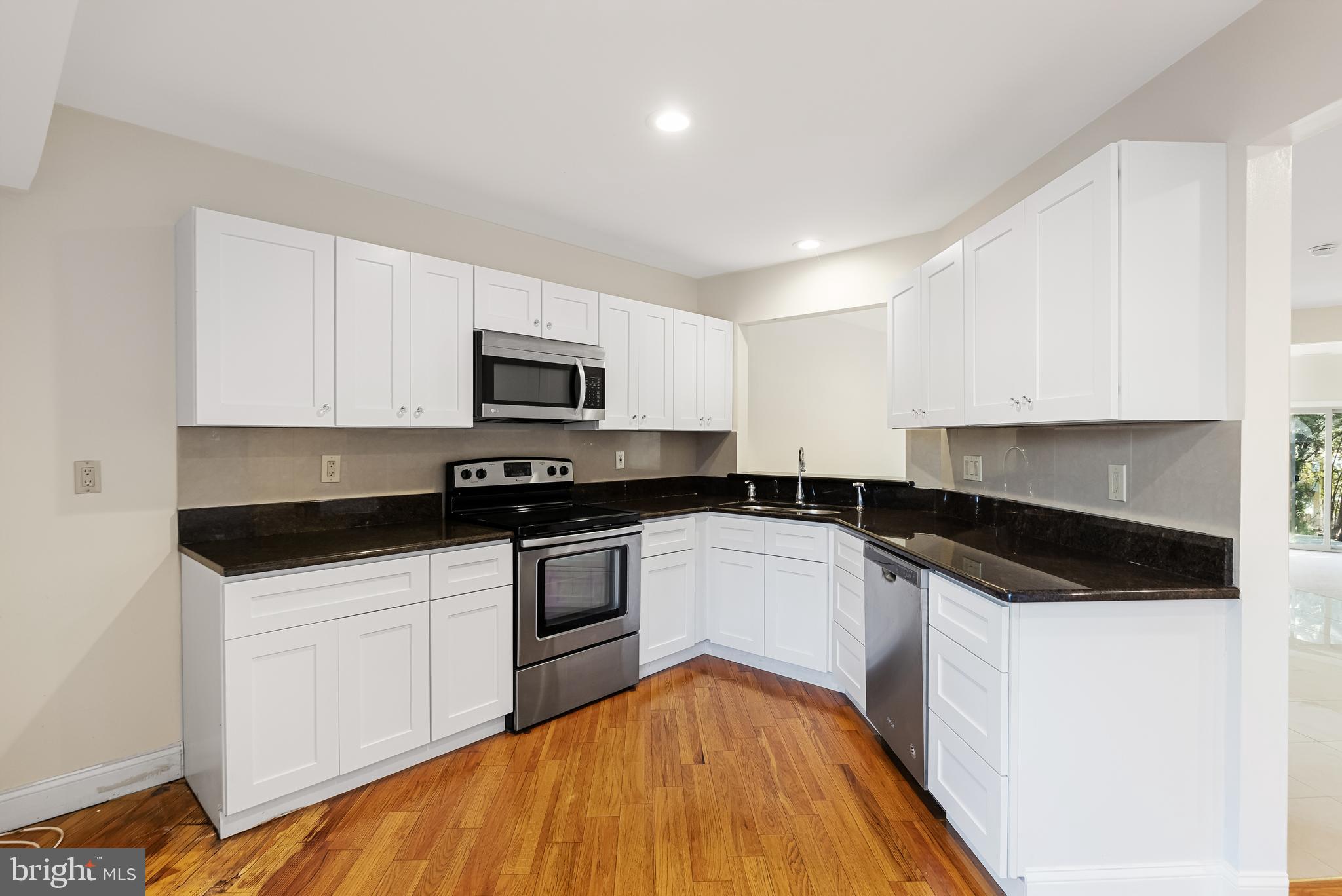 962 Chanticleer Cherry Hill, NJ 08003 - Photo 15 of 38 a kitchen with granite countertop a sink and steel appliances