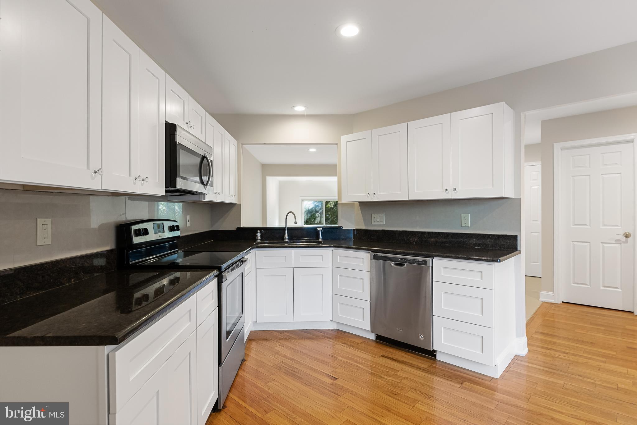 962 Chanticleer Cherry Hill, NJ 08003 - Photo 16 of 38 a kitchen with stainless steel appliances granite countertop a stove and a sink