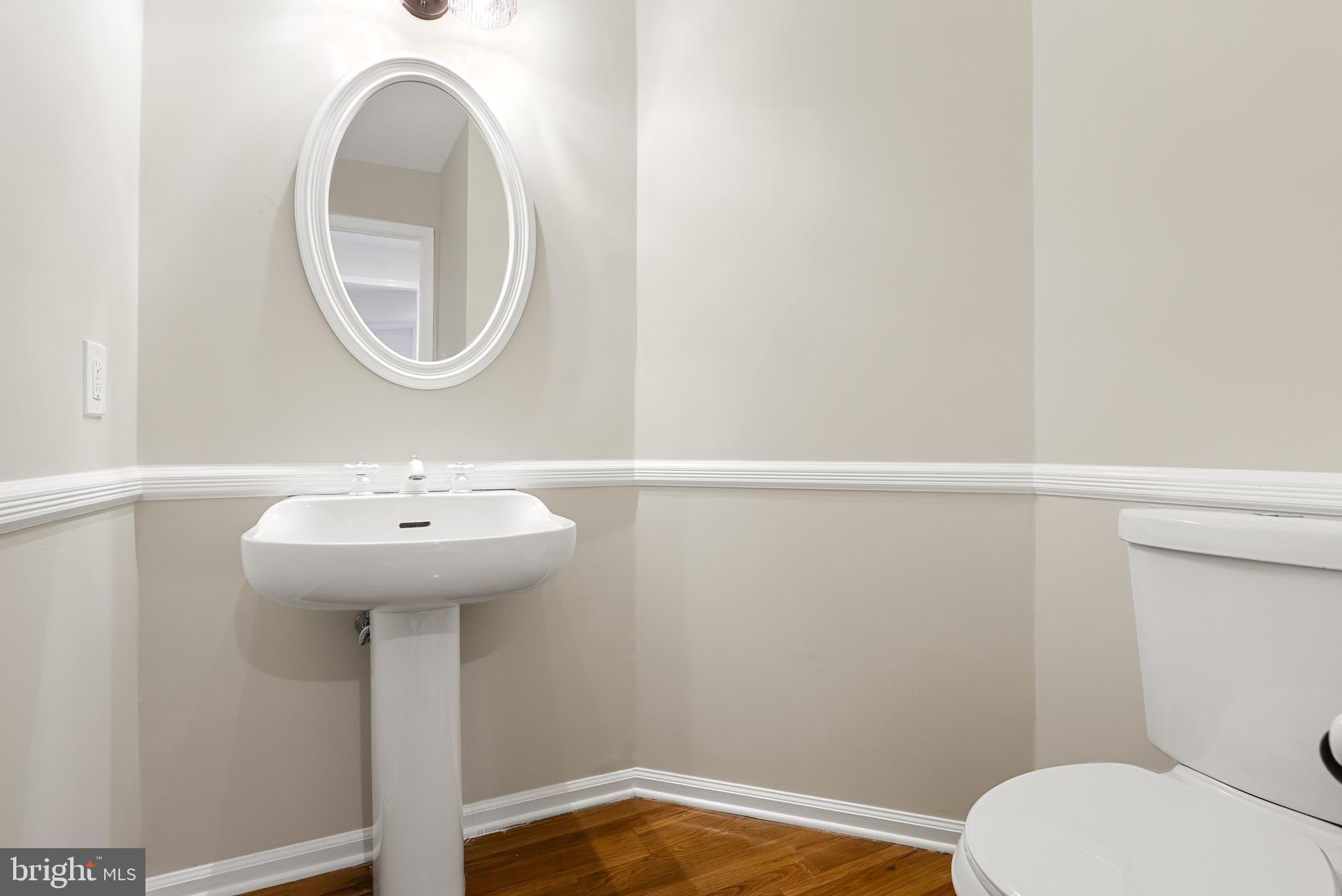 962 Chanticleer Cherry Hill, NJ 08003 - Photo 19 of 38 a bathroom with a sink mirror and toilet