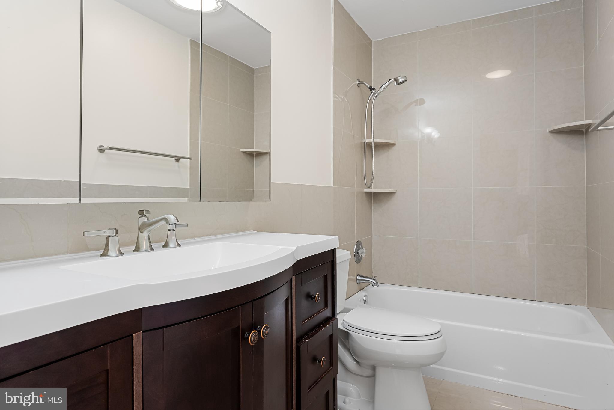 962 Chanticleer Cherry Hill, NJ 08003 - Photo 34 of 38 a bathroom with a sink a toilet and shower