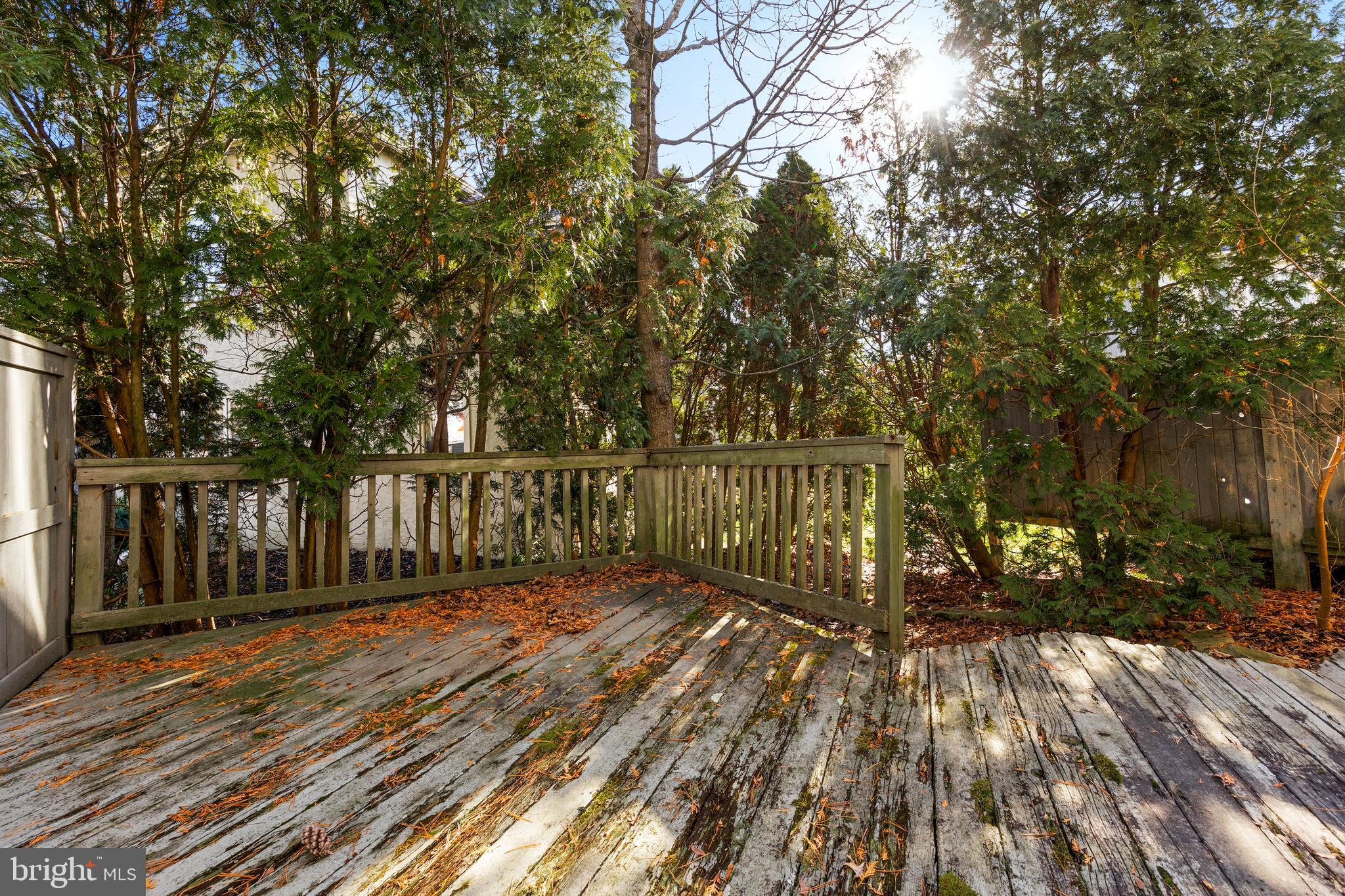962 Chanticleer Cherry Hill, NJ 08003 - Photo 38 of 38 a view of deck with wooden floor and fence