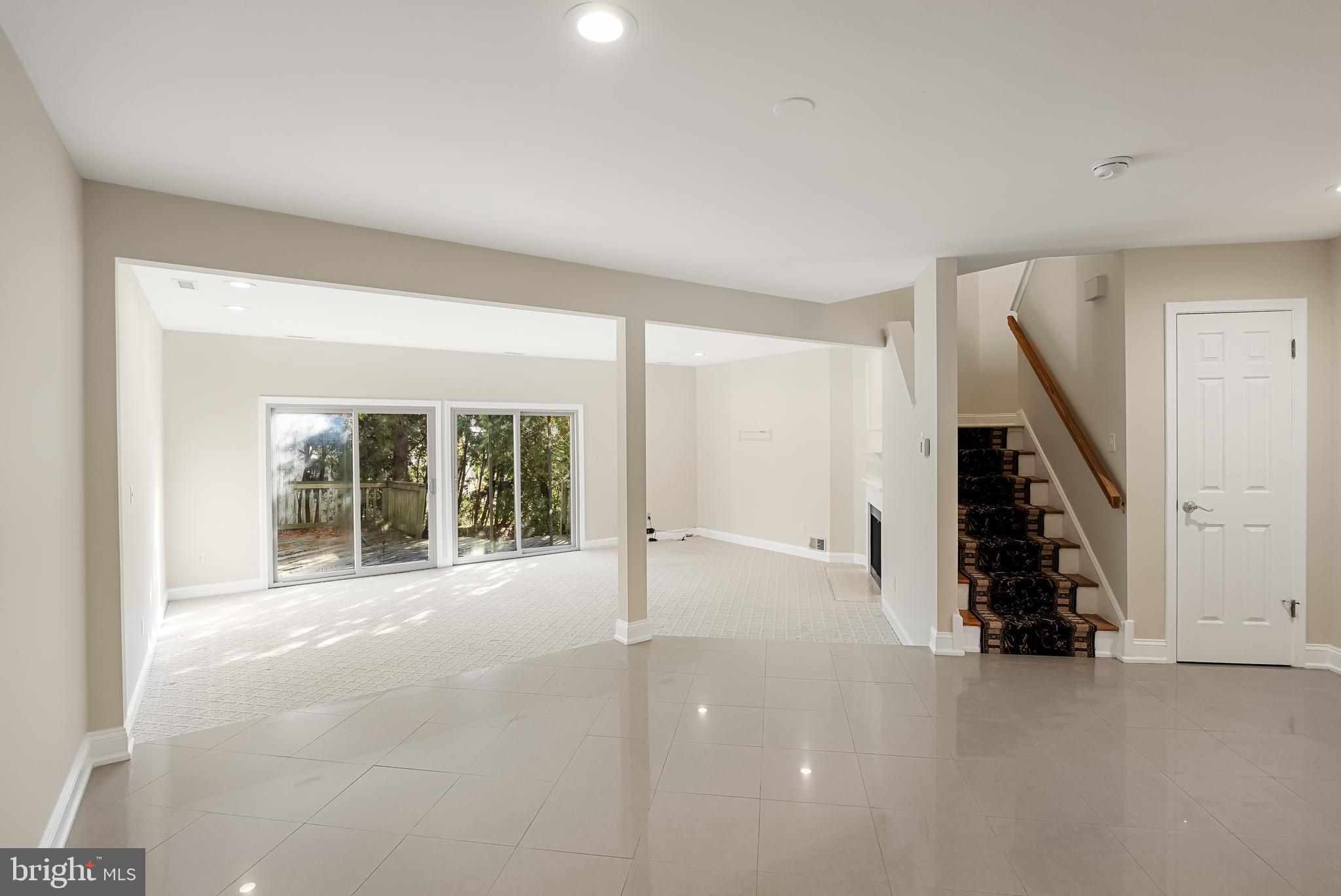 962 Chanticleer Cherry Hill, NJ 08003 - Photo 10 of 38 a view of an empty room with wooden floor and stairs