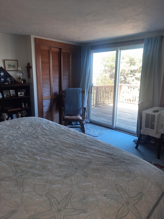 21 Manchester Street, Unit 21 Scituate, MA 02066 - Photo 4 of 11 a living room with furniture and a window
