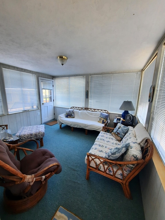21 Manchester Street, Unit 21 Scituate, MA 02066 - Photo 8 of 11 a living room with furniture and a wooden floor
