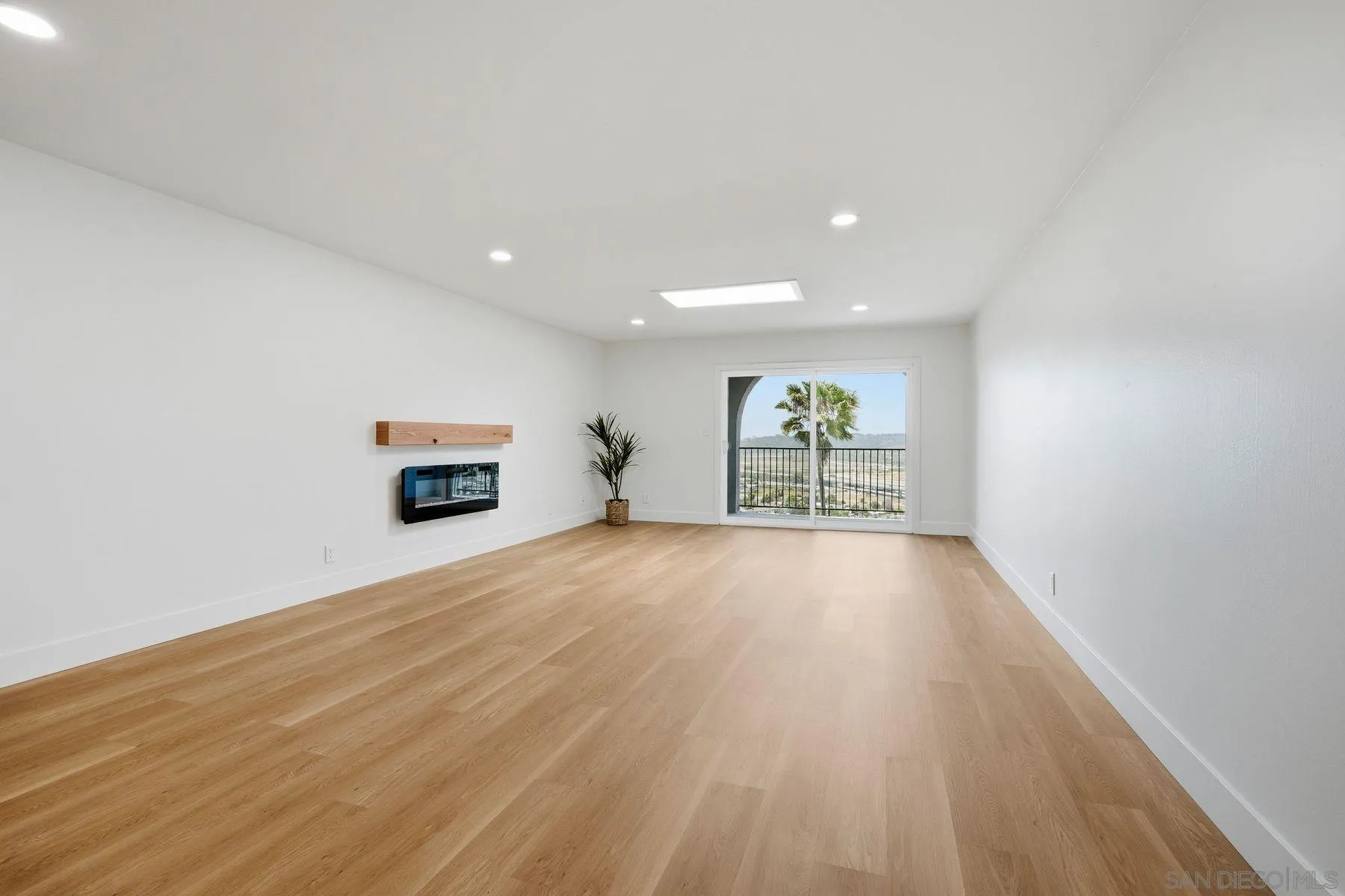 3606 Vista Rey, Unit 46 Oceanside, CA 92057 - Photo 9 of 36 a view of empty room with wooden floor