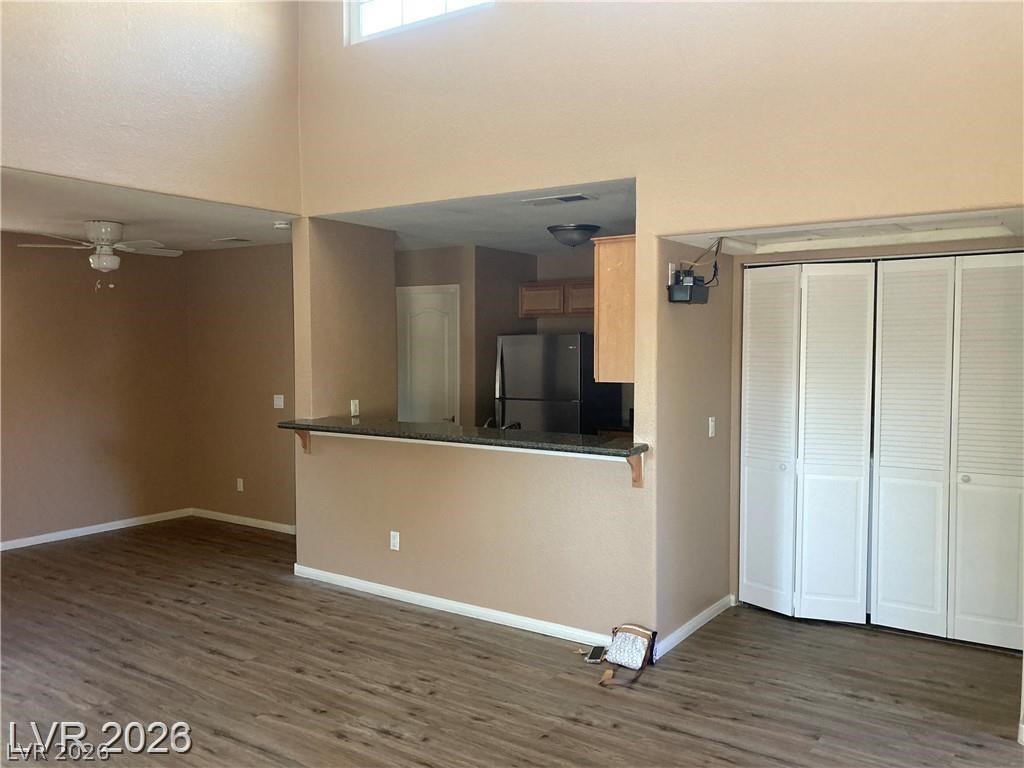 3145 East Flamingo Road, Unit 2100 Las Vegas, NV 89121 - Photo 6 of 34 A streamlined open-concept design with durable flooring, linking living space to a compact kitchen.
