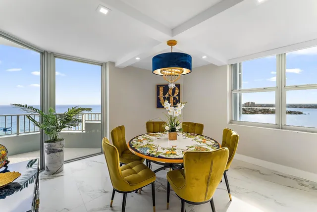 a view of a dining room with furniture and window