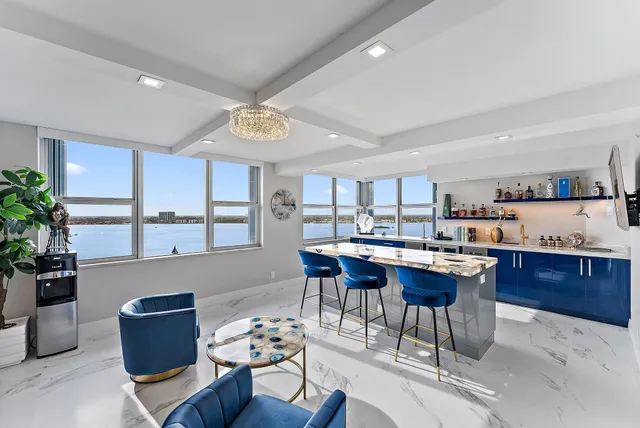 a living room with a couch and a potted plant