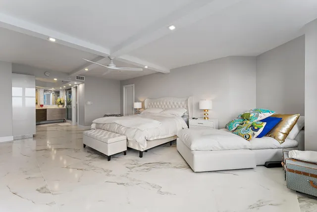 a bedroom with a bed and couch