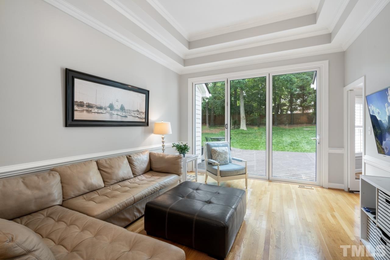4401 Touchstone Forest Road Raleigh, NC 27612 - Photo 12 of 44 a living room with furniture and a large window