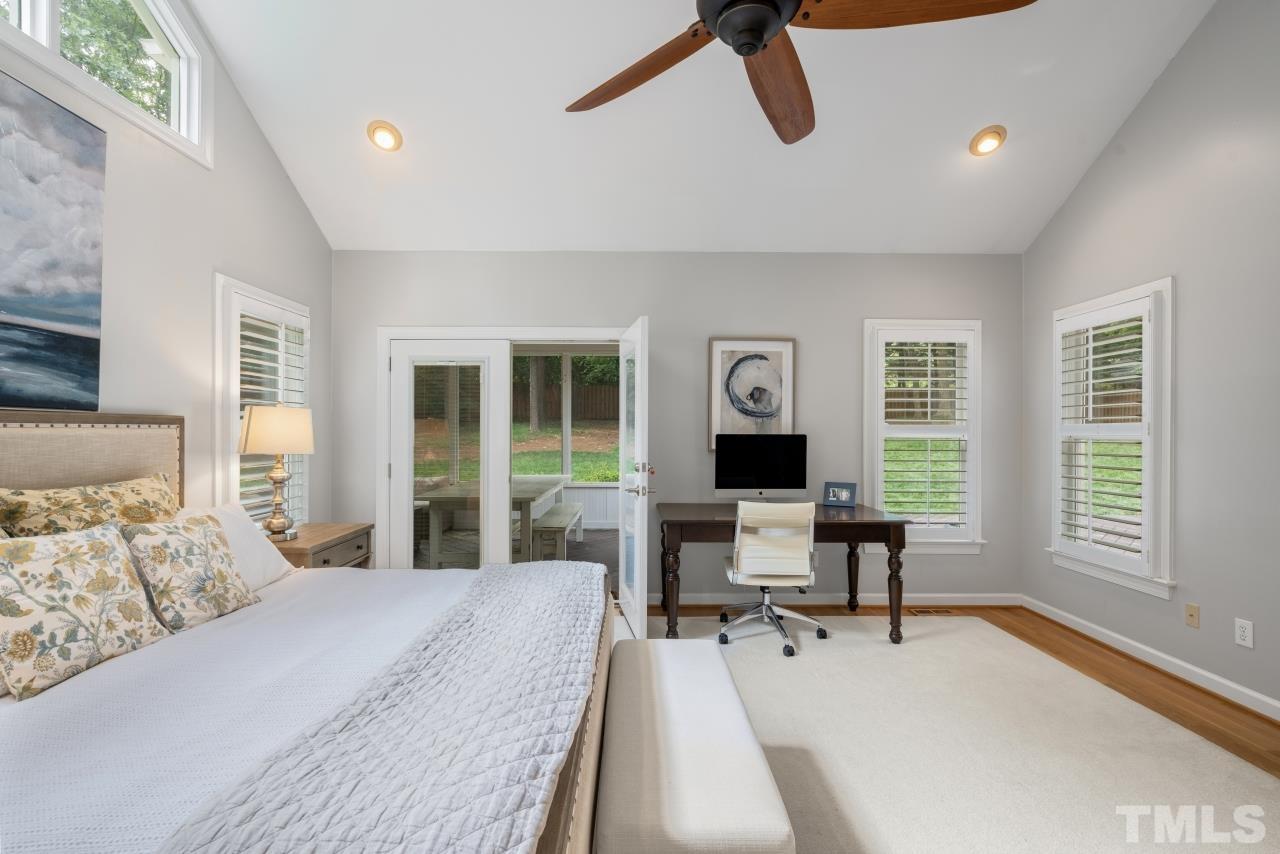 4401 Touchstone Forest Road Raleigh, NC 27612 - Photo 25 of 44 a bedroom with a bed large window with table and chair