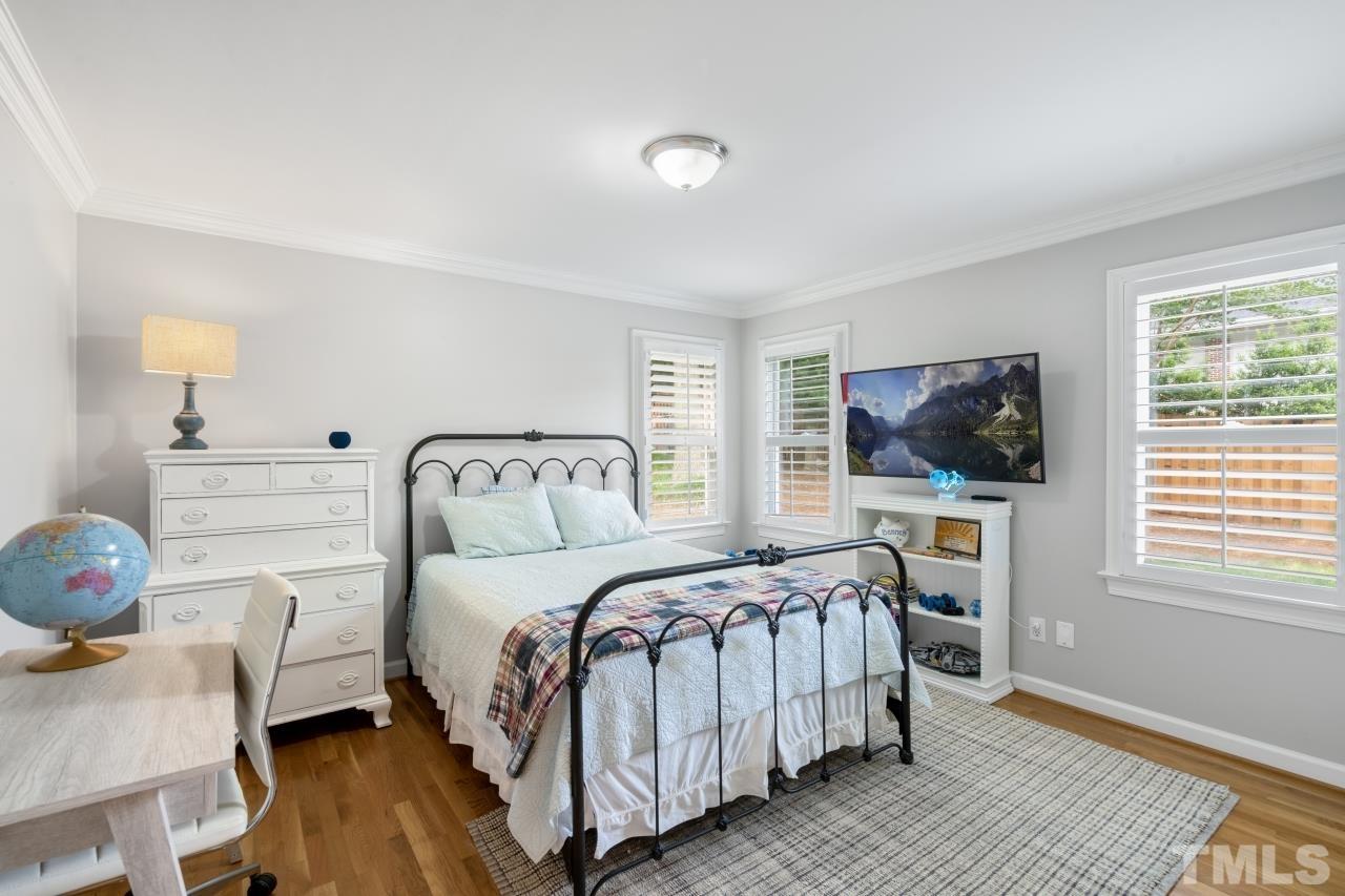 4401 Touchstone Forest Road Raleigh, NC 27612 - Photo 27 of 44 a bedroom with a bed and wooden floor