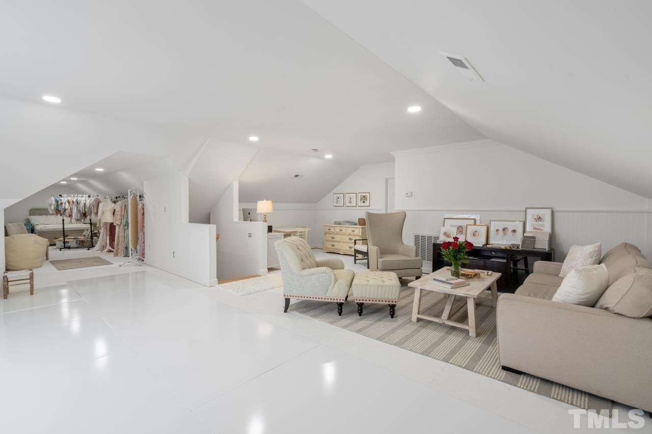 4401 Touchstone Forest Road Raleigh, NC 27612 - Photo 30 of 44 a living room with furniture and a table