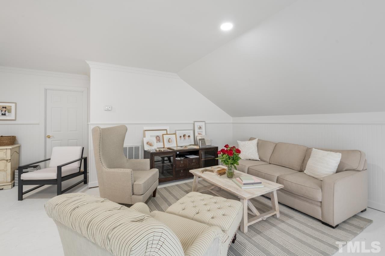4401 Touchstone Forest Road Raleigh, NC 27612 - Photo 31 of 44 a living room with furniture and a couch