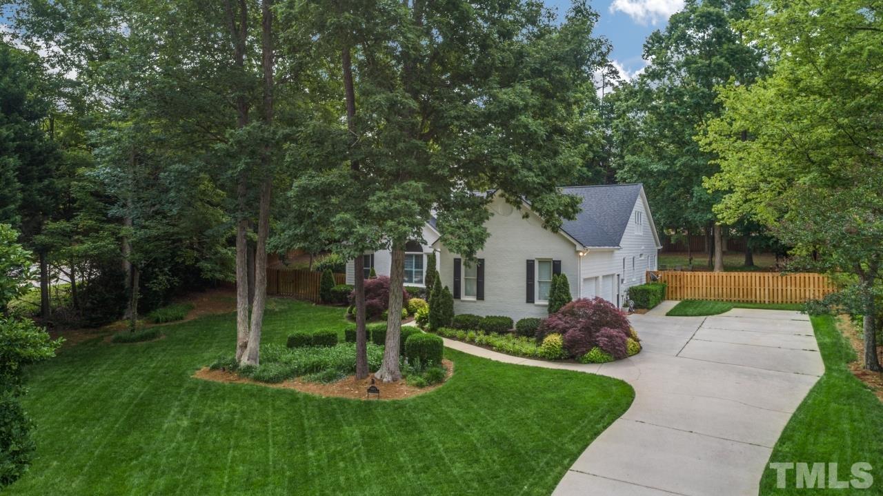 4401 Touchstone Forest Road Raleigh, NC 27612 - Photo 38 of 44 a front view of a house with garden