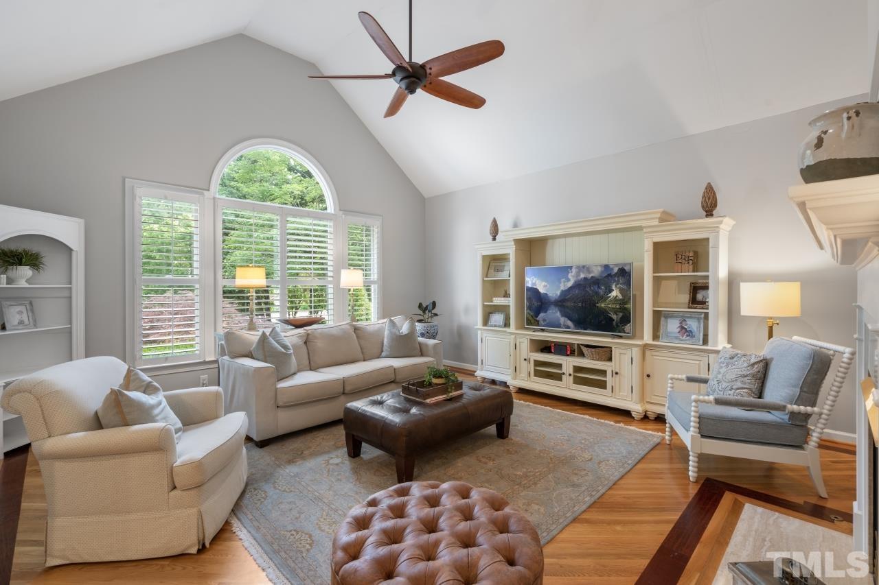4401 Touchstone Forest Road Raleigh, NC 27612 - Photo 6 of 44 a living room with furniture and a flat screen tv
