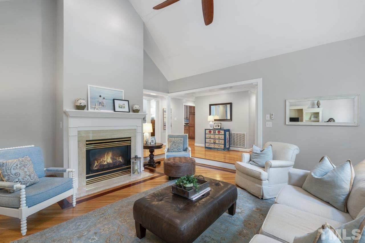 4401 Touchstone Forest Road Raleigh, NC 27612 - Photo 7 of 44 a living room with furniture and a fireplace