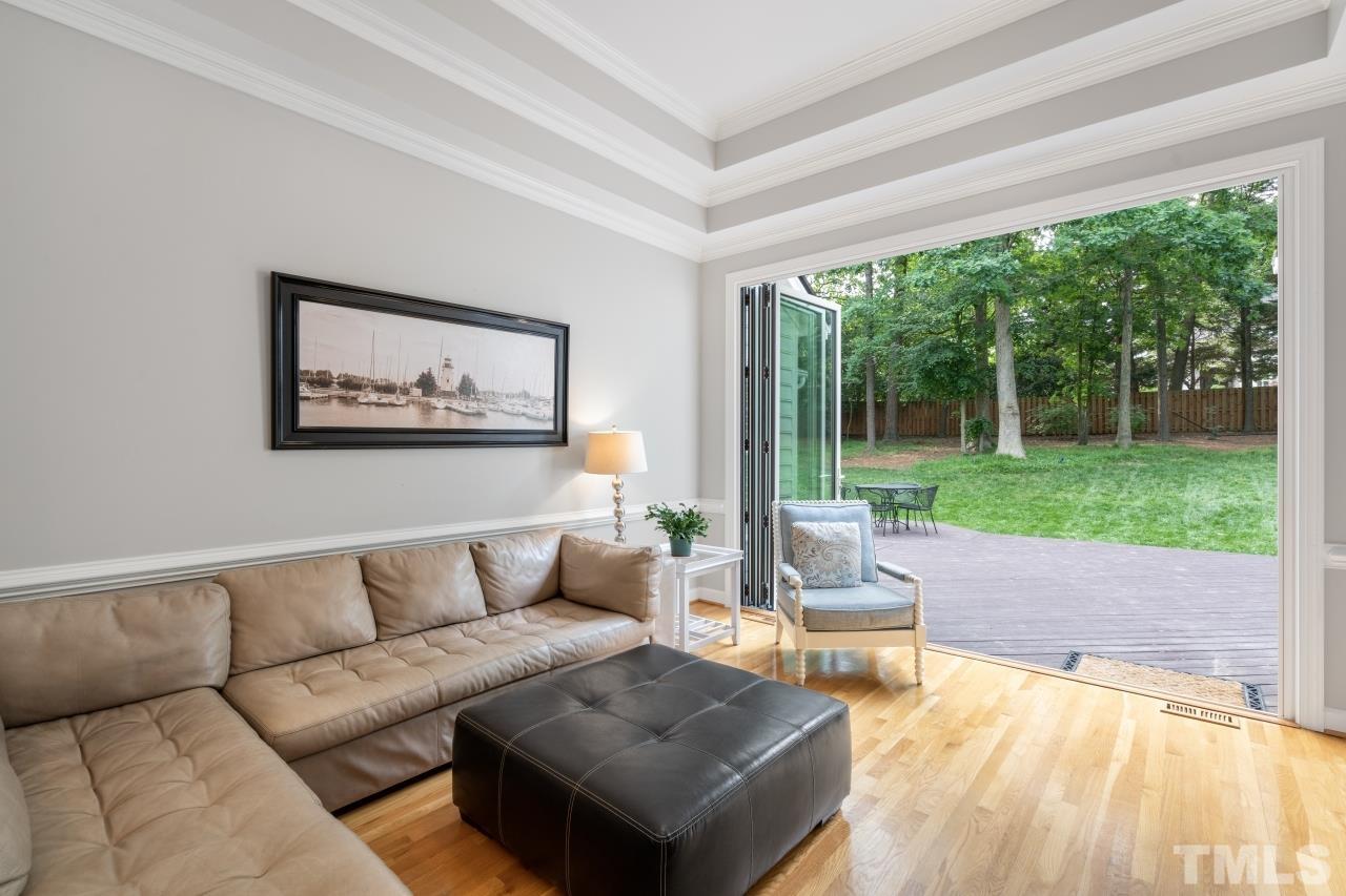 4401 Touchstone Forest Road Raleigh, NC 27612 - Photo 8 of 44 a living room with furniture and a large window