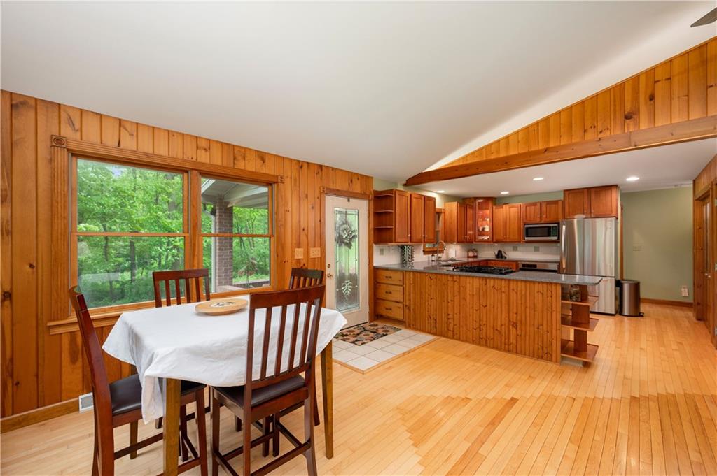 223 Cashdollar Road Mars, PA 16046 - Photo 12 of 42 a view of a dining room with furniture a chandelier and wooden floor