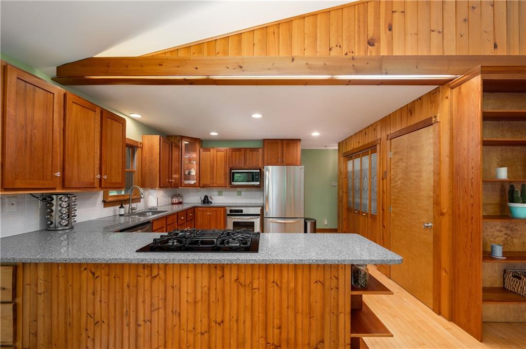 223 Cashdollar Road Mars, PA 16046 - Photo 17 of 42 a kitchen with a table chairs in it and wooden floors