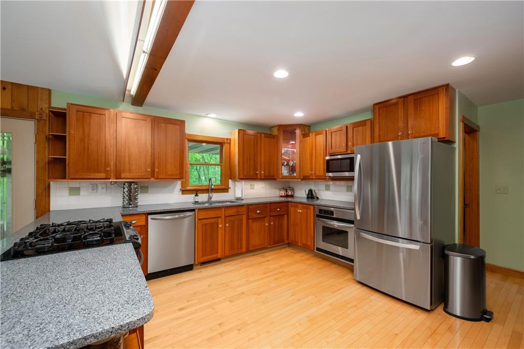 223 Cashdollar Road Mars, PA 16046 - Photo 18 of 42 a kitchen with stainless steel appliances granite countertop a refrigerator stove and sink