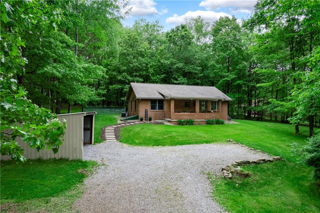223 Cashdollar Road Mars, PA 16046 - Photo 2 of 42 a front view of a house with yard and green space