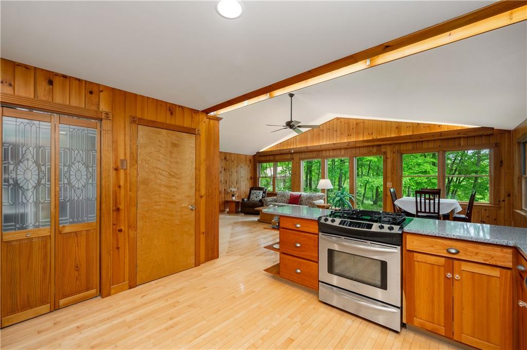 223 Cashdollar Road Mars, PA 16046 - Photo 21 of 42 a kitchen that has a stove and a wooden floor