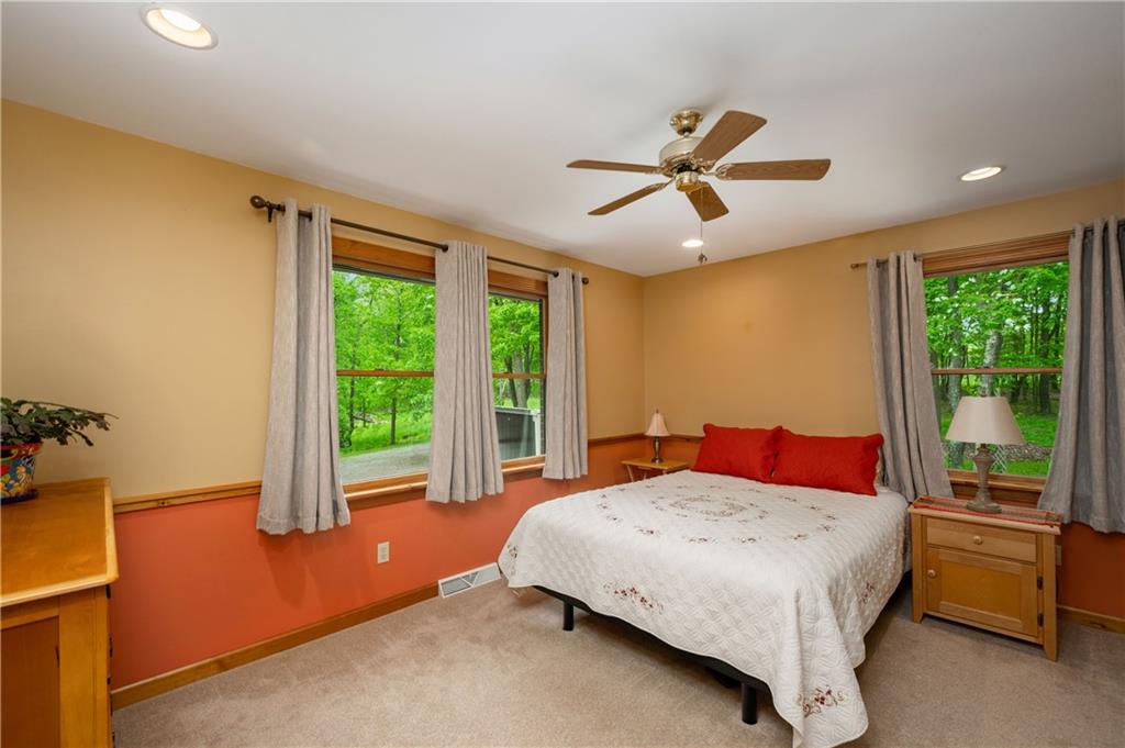 223 Cashdollar Road Mars, PA 16046 - Photo 23 of 42 a bedroom with a bed and a chandelier