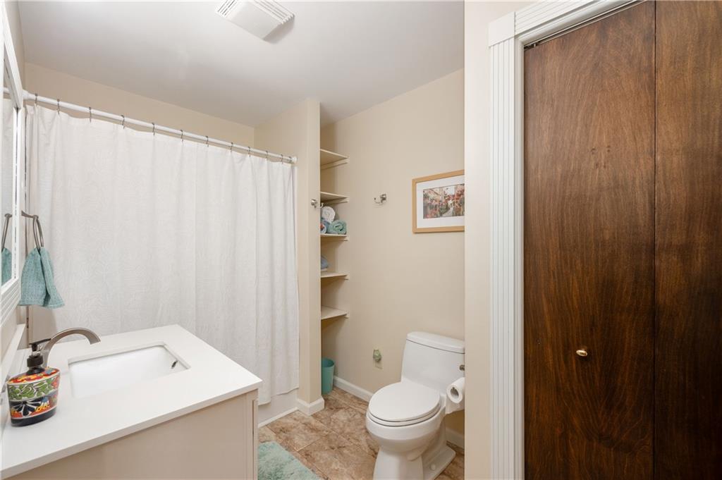 223 Cashdollar Road Mars, PA 16046 - Photo 28 of 42 a bathroom with a sink a toilet and shower curtain